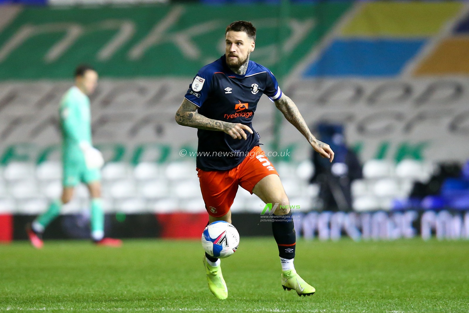 Sonny Bradley #5 of Luton Town dribbles the ball