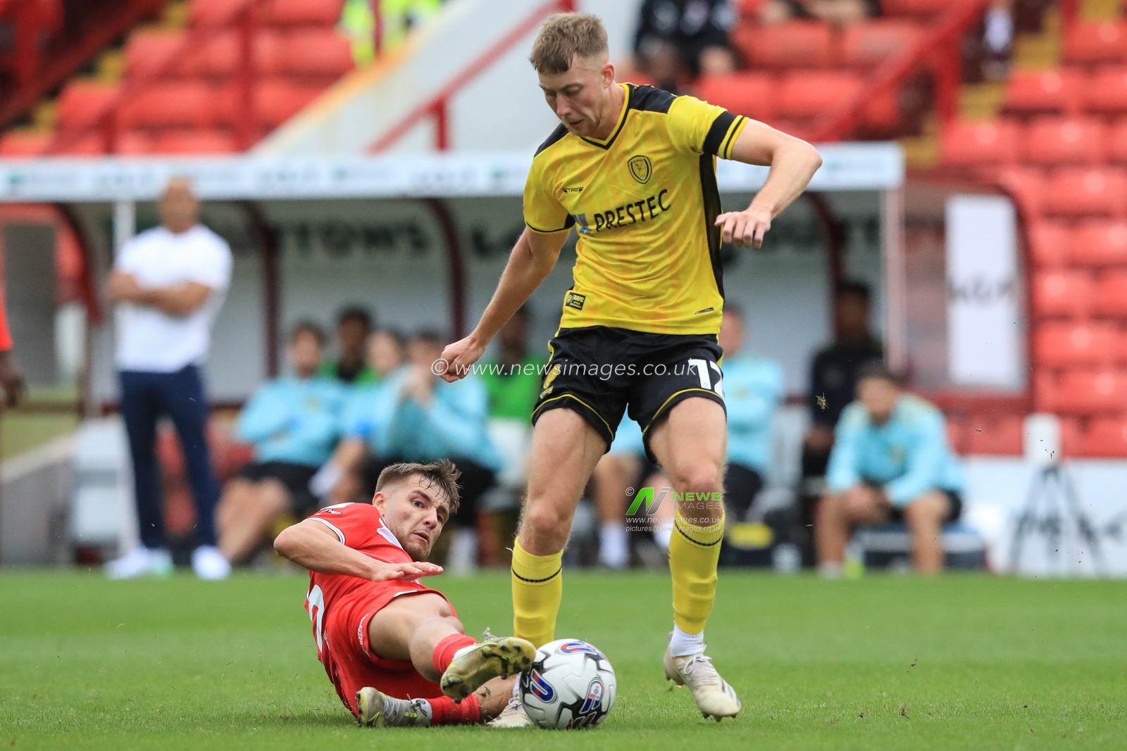John Mcatee #45 of Barnsley tackles the ball from Jasper Moon #12 of Burton Albion during the Sky Bet League 1 match Barnsley vs Burton Albion at Oakwell, Barnsley, United Kingdom, 16th September 2023

(Photo by Alfie Cosgrove/News Images)