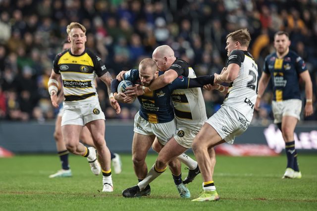 Jarrod O'Connor of Leeds Rhinos is tackled by Jordan Thompson and Oli Field of York Knights during the Betfred Super League Round 2 match Leeds Rhinos vs York Knights at AMT Headingley Stadium, Leeds, United Kingdom on 20 February 2026

(Photo by Mark Cosgrove/News Images)