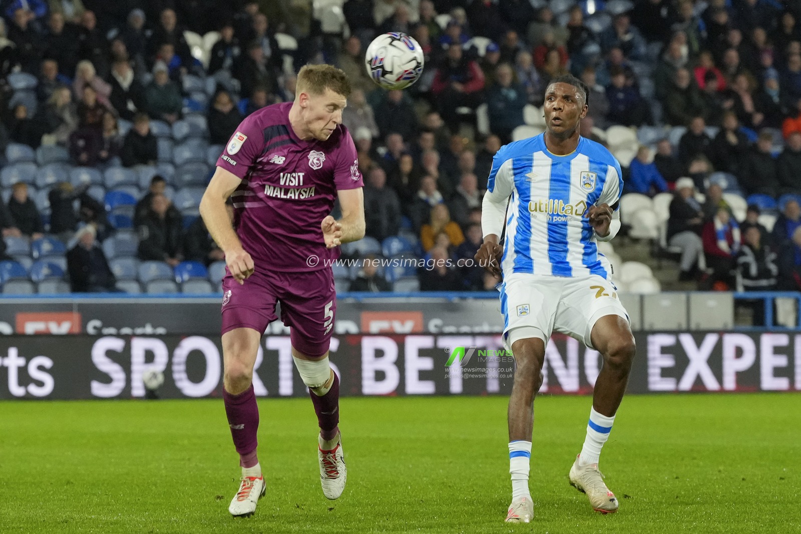 Mark McGuinness #5 of Cardiff City heads clear under pressure from Kyle Hudlin #27 of Huddersfield Town during the Sky Bet Championship match Huddersfield Town vs Cardiff City at John Smith's Stadium, Huddersfield, United Kingdom, 24th October 2023

(Photo by Steve Flynn/News Images)