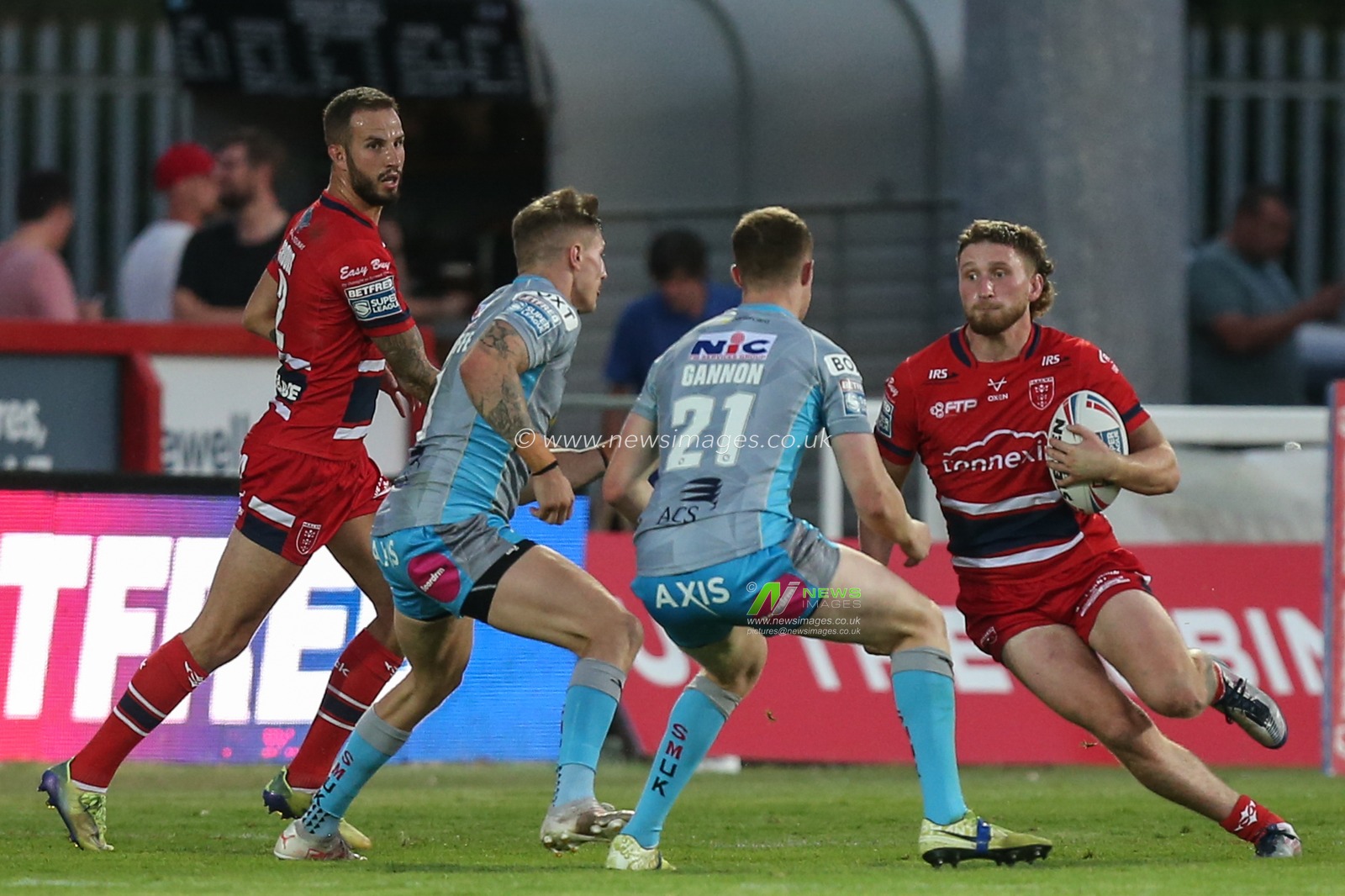 Ethan Ryan #23 of Hull KR runs at the Leeds defence