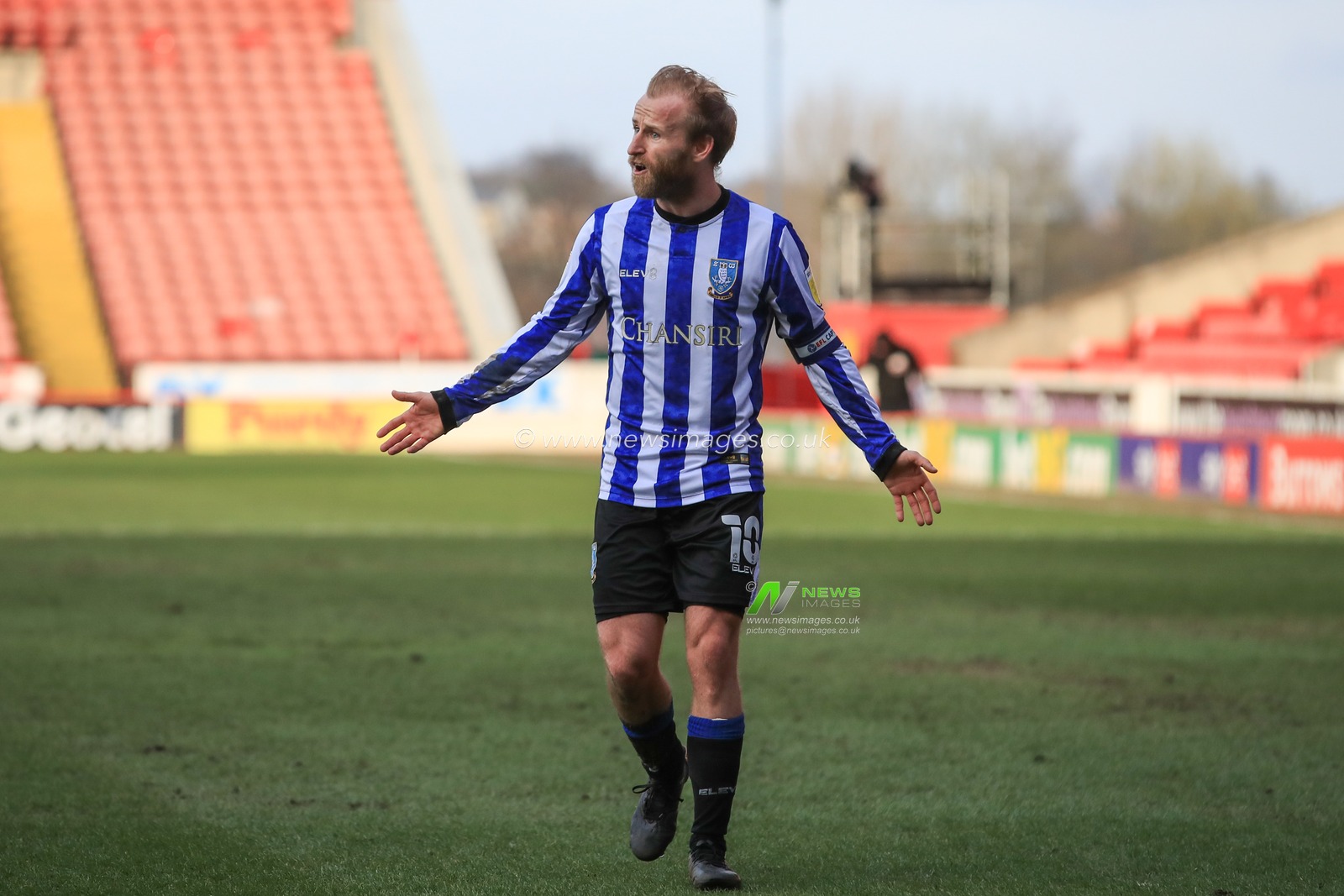 Barry Bannan #10 of Sheffield Wednesday appeals to referee Tim Robinson
