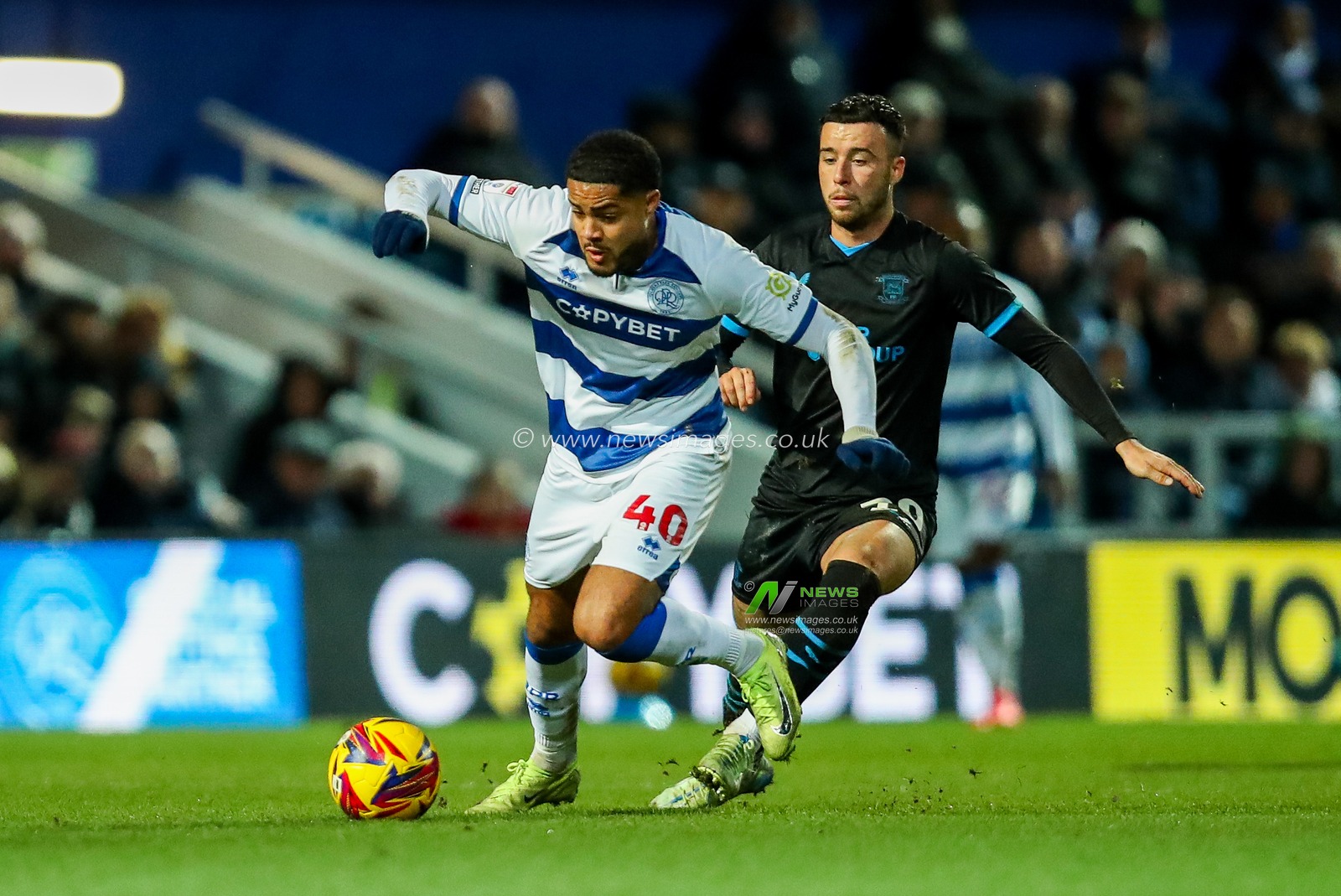 Jonathan Varane of Queens Park Rangers is put under pressure by Sam Greenwood of Preston North End during the Sky Bet Championship match Queens Park Rangers vs Preston North End at Matrade Loftus Road, London, United Kingdom, 21st December 2024

(Photo by Izzy Poles/News Images)