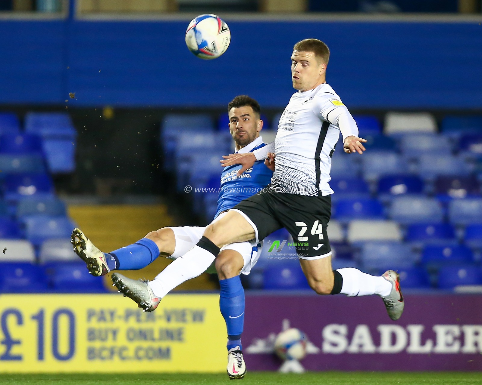 Maxime Colin #2 of Birmingham City crosses the ball whilst under pressure from Jake Bidwell #24 of Swansea City