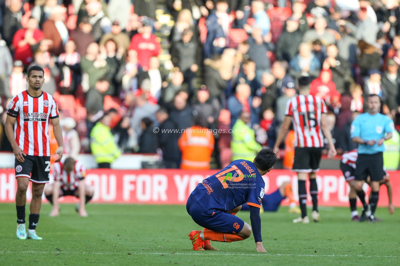 Kenny Dougall #12 of Blackpool dejected at the final whistle during the Sky Bet Championship match Sheffield United vs Blackpool at Bramall Lane, Sheffield, United Kingdom, 15th October 2022

(Photo by Arron Gent/News Images)