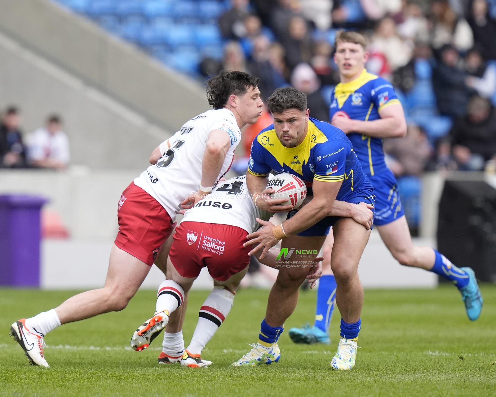 Joe Philbin of Warrington Wolves runs at the Salford Red Devils defence during the Betfred Super League Round 9 match Salford Red Devils vs Warrington Wolves at Salford Community Stadium, Eccles, United Kingdom, 27th April 2024

(Photo by Steve Flynn/News Images)