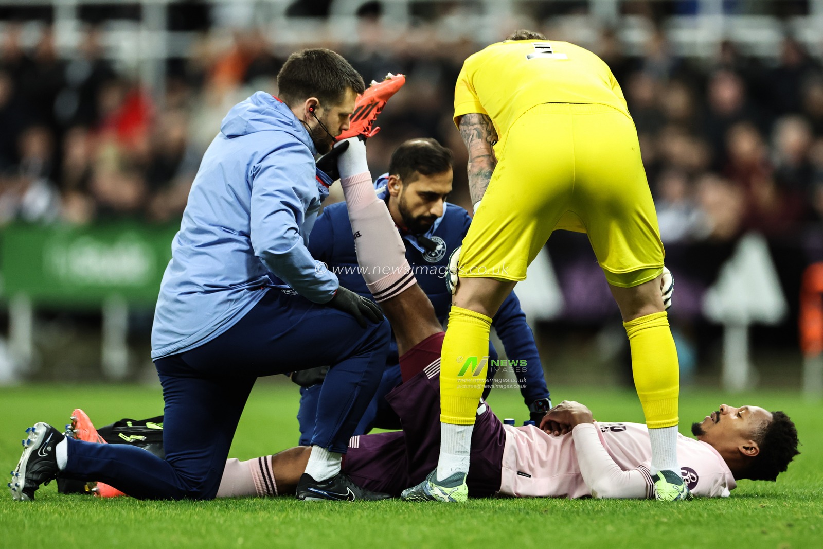 Ethan Pinnock of Brentford receives medical treatment during the Carabao Cup Quarter Final Newcastle United vs Brentford at St. James's Park, Newcastle, United Kingdom, 18th December 2024

(Photo by Mark Cosgrove/News Images)