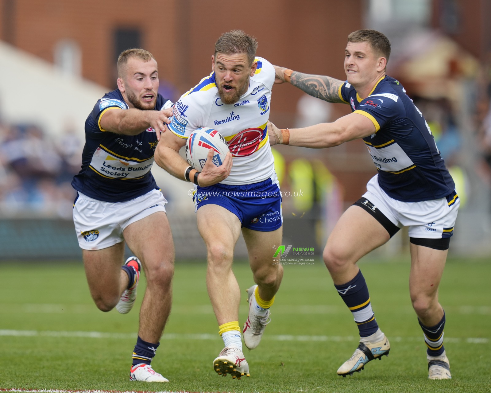 Matt Dufty #1 of Warrington Wolves breaks past Jarrod Oâ€™Connor #14 of Leeds Rhinos and Corey Johnson #26 of Leeds Rhinos during the Betfred Super League Round 22 match Leeds Rhinos vs Warrington Wolves at Headingley Stadium, Leeds, United Kingdom, 20th August 2023

(Photo by Steve Flynn/News Images)