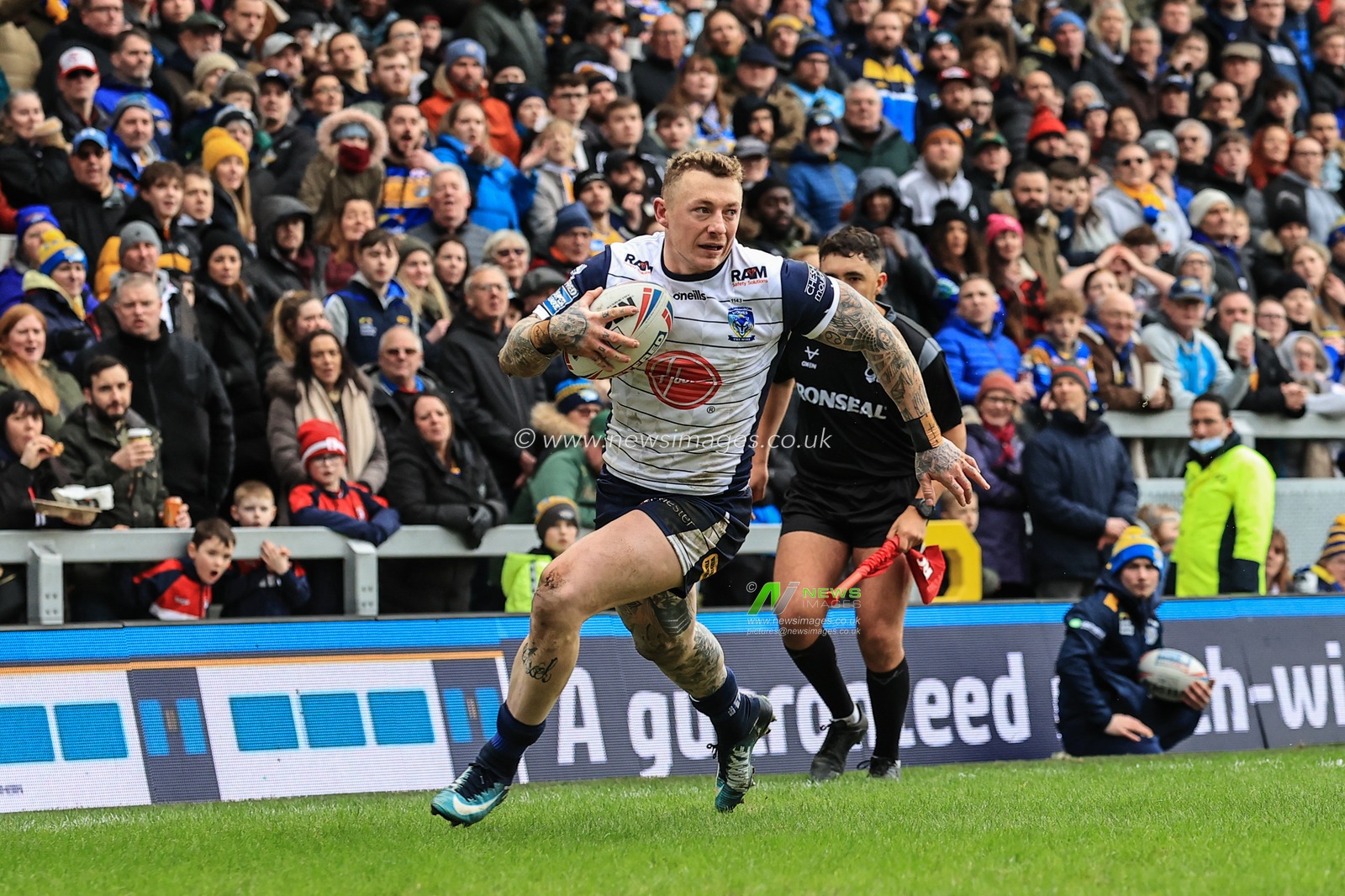 Josh Charnley #2 of Warrington Wolves goes over for a try