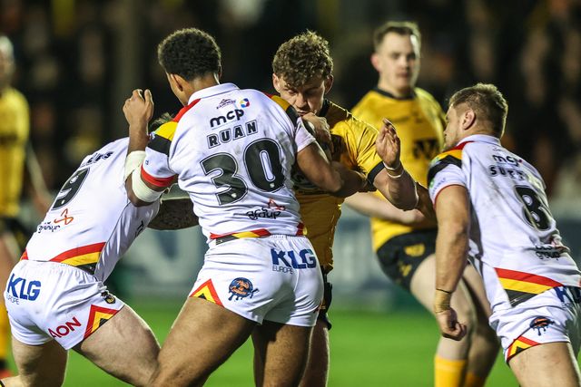 George Lawler of Castleford Tigers is tackled by Andy Ackers of Bradford Bulls and Leon Ruan of Bradford Bulls during the Betfred Super League round 6 match Castleford Tigers vs Bradford Bulls at OneBore Stadium, Castleford, Untied Kingdom on 26 March 2026

(Photo by Alfie Cosgrove/News Images)