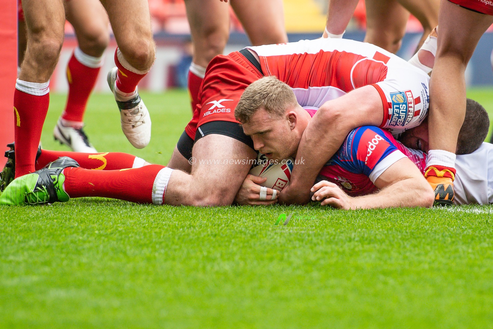 26th May 2019 , Anfield Stadium, Liverpool, England; Dacia Magic Weekend, Betfred Super League Round 16, Salford Red Devils vs Hull KR ; Joey Lussick (14) of Salford Red Devils goes over for a try

Credit: Craig Thomas/News Images