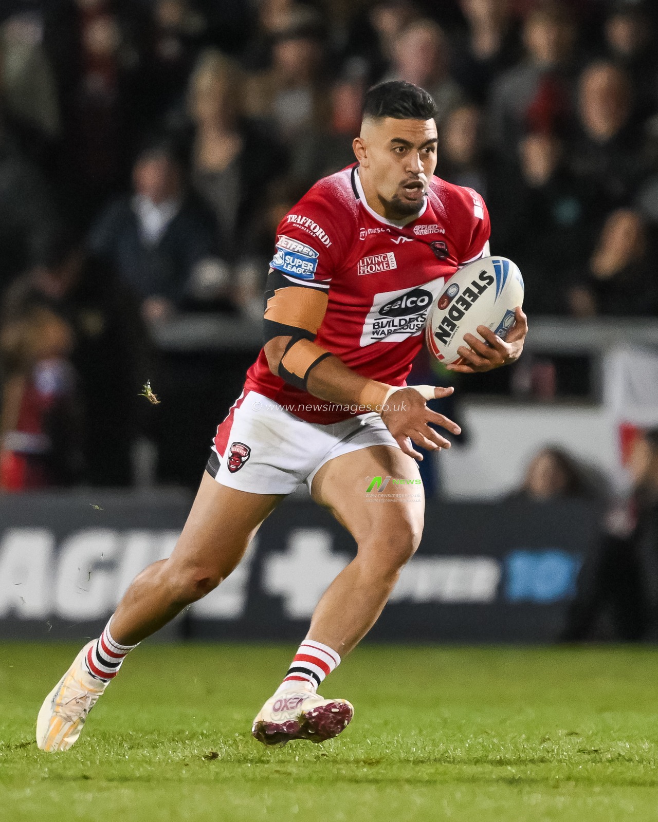 Tim Lafai of Salford Red Devils makes a break during the Betfred Super League play-off Eliminator 1 Salford Red Devils v Leigh Leopards at Salford Community Stadium, Eccles, United Kingdom, 27th September 2024

(Photo by Craig Thomas/News Images)