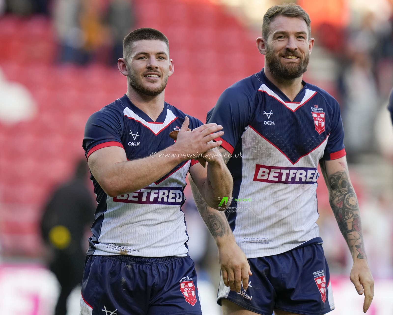 Daryl Clark #9 of England celebrates with Danny Walker #14 of England after the Rugby League International match England vs Tonga at Totally Wicked Stadium, St Helens, United Kingdom, 22nd October 2023

(Photo by Steve Flynn/News Images)