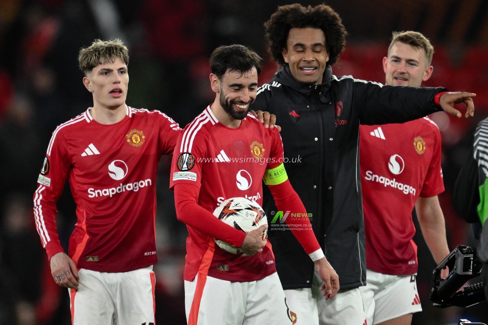Bruno Fernandes of Manchester United collects the match ball after scoring a hat-trick during the UEFA Europa League Last 16 match Manchester United vs Real Sociedad at Old Trafford, Manchester, United Kingdom, 13th March 2025

(Photo by Craig Thomas/News Images)