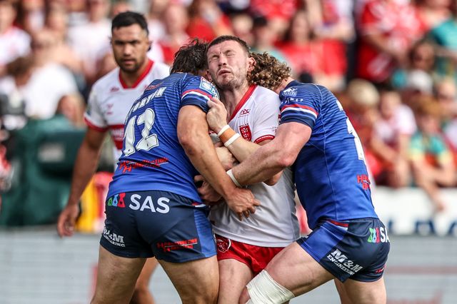 James Batchelor of Hull KR is tackled by Matty Storton of Wakefield Trinity and Ky Rodwell of Wakefield Trinity during the Betfred Super League round 18 match Hull KR vs Wakefield Trinity at Sewell Group Craven Park, Hull, United Kingdom on 11 July 2026

(Photo by Alfie Cosgrove/News Images)