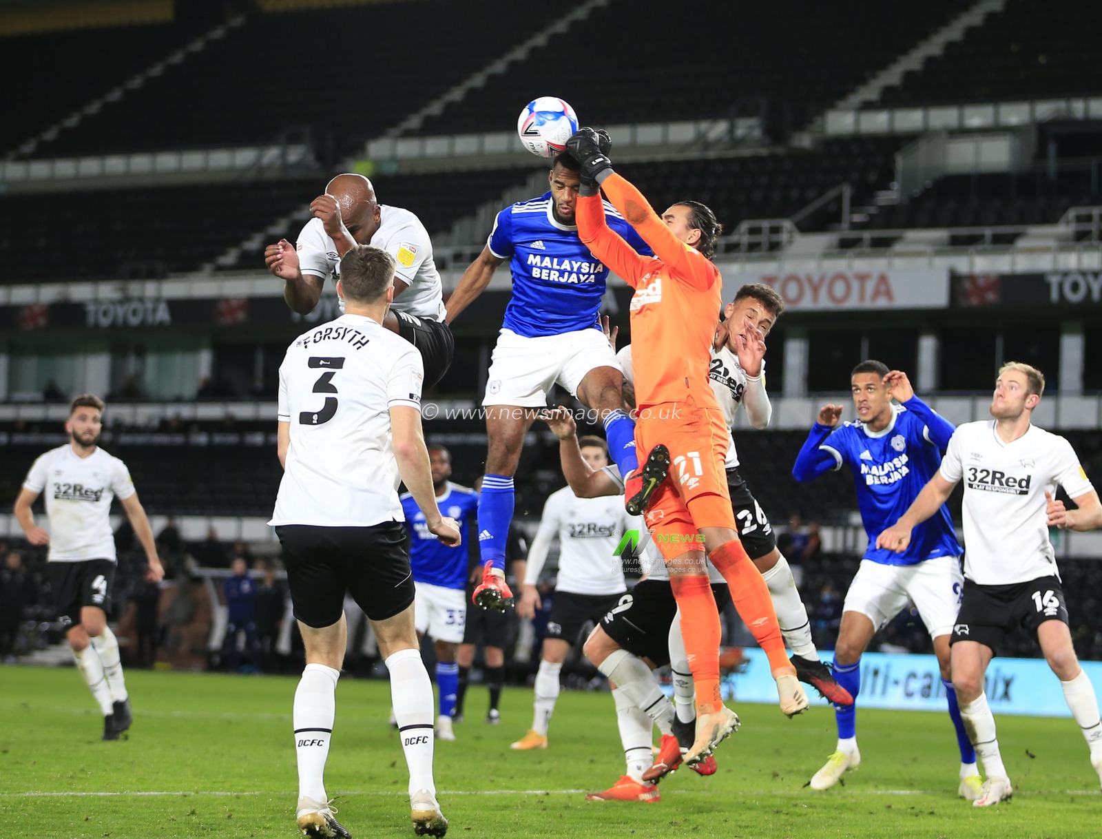 Kelle Roos (21) of Derby County punches the ball clear