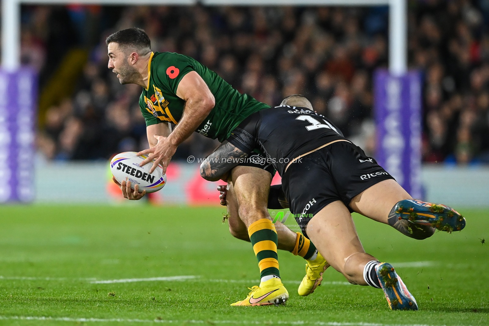 James Tedesco of Australia is tackled by Nelson Asofa-Solomona of New Zealand during the Rugby League World Cup 2021 Semi Final match Australia vs New Zealand at Elland Road, Leeds, United Kingdom, 11th November 2022

(Photo by Craig Thomas/News Images)