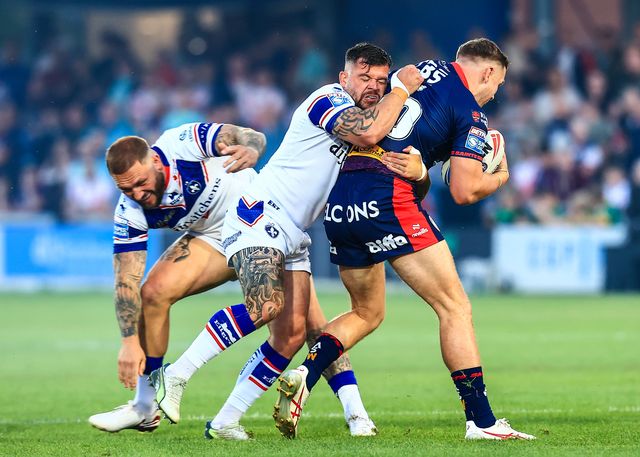 Matty Lees of St. Helens is tackled by Liam Hood of Wakefield Trinity during the Betfred Super League round 21 match Wakefield Trinity vs St Helens at DIY Kitchens Stadium, Wakefield, United Kingdom, 8th August 2025

(Photo by Richard Bierton/News Images)