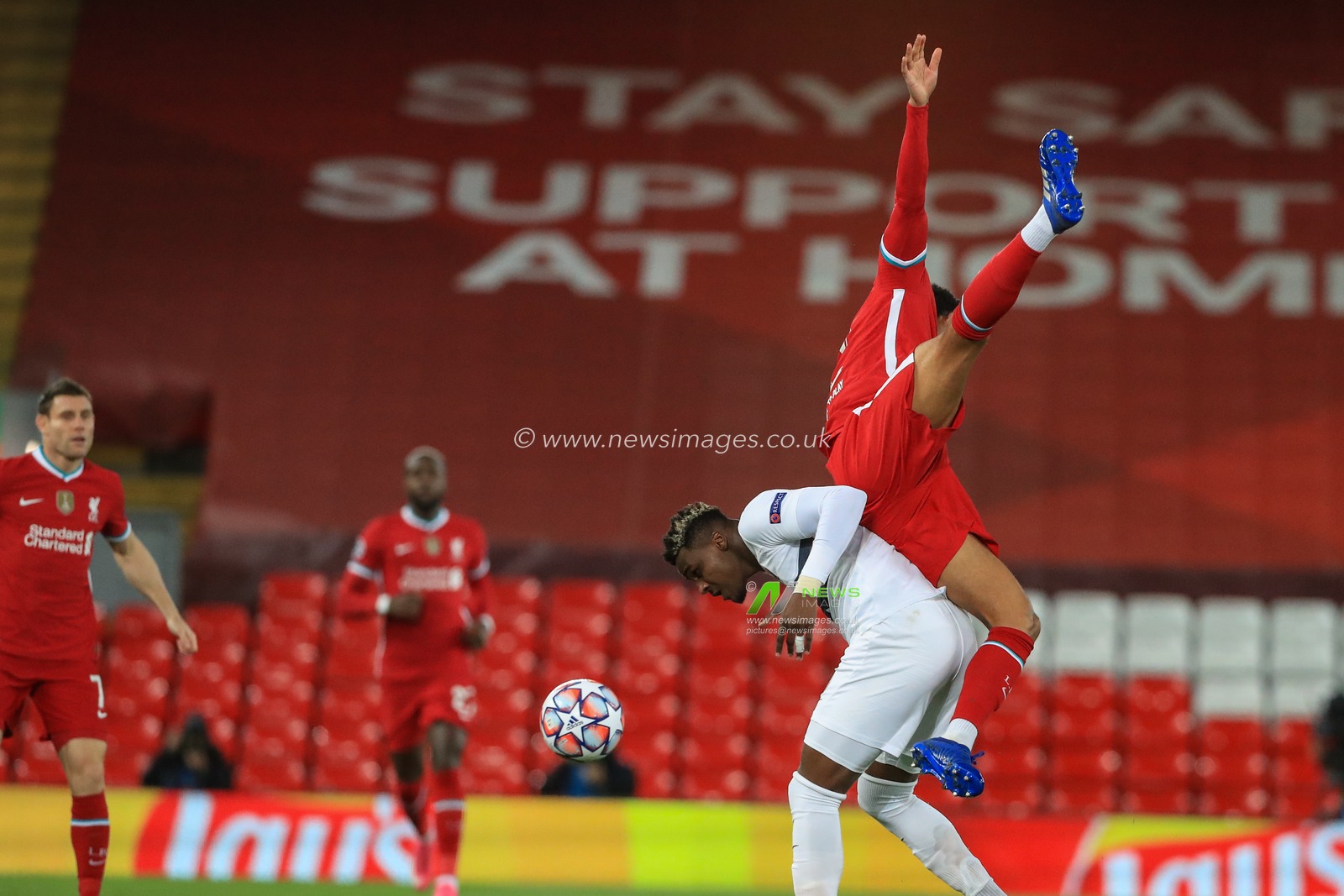 Sory Kaba (9) of FC Midtjylland fouls Joe Gomez (12) of Liverpool