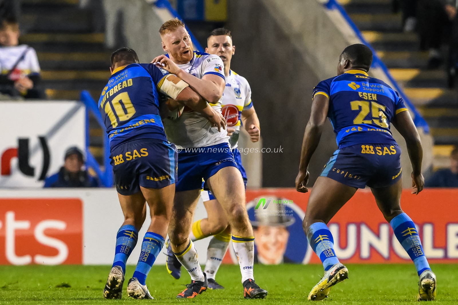 Joe Bullock #19 of Warrington Wolves is tackled by Jai Whitbread #10 of Wakefield Trinity during the Betfred Super League Round 11 match Warrington Wolves vs Wakefield Trinity at Halliwell Jones Stadium, Warrington, United Kingdom, 5th May 2023

(Photo by Craig Thomas/News Images)