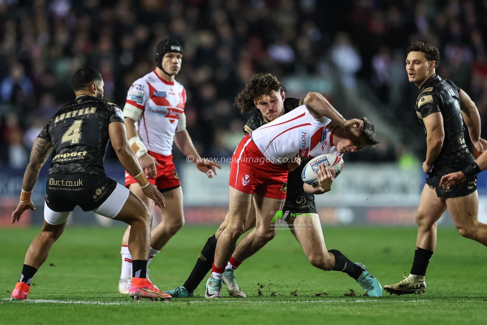 Jack Welsby of St. Helens is tackled by Robbie Mulhern of Leigh Leopards during the Betfred Super League Round 3 match St Helens vs Leigh Leopards at Totally Wicked Stadium, St Helens, United Kingdom, 1st March 2024

(Photo by Mark Cosgrove/News Images)
