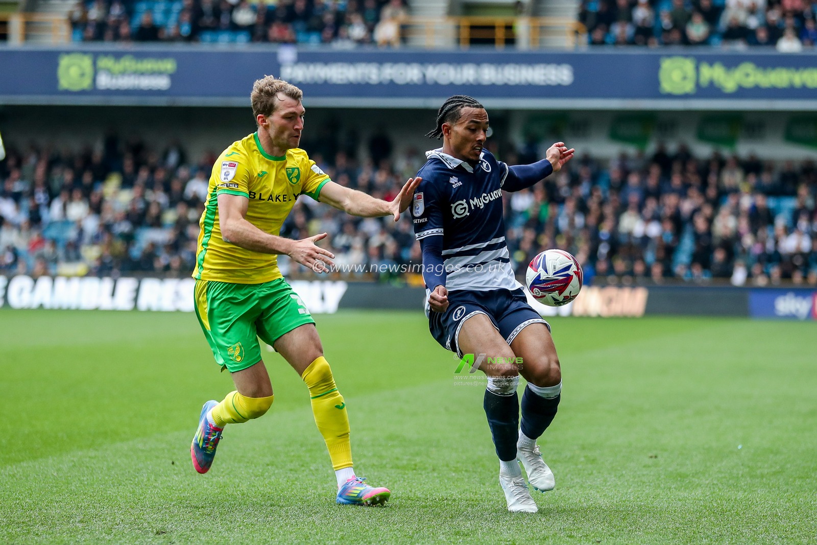 Femi Azeez of Millwall is put under pressure by Jack Stacey of Norwich City during the Sky Bet Championship match Millwall vs Norwich City at The Den, London, United Kingdom, 21st April 2025

(Photo by Izzy Poles/News Images)