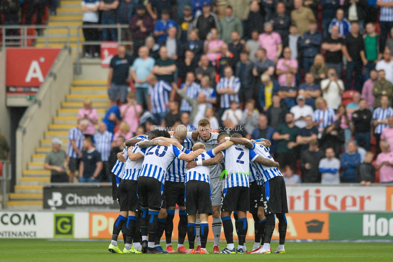 The Sheffield Wednesday players form a huddle before the game
