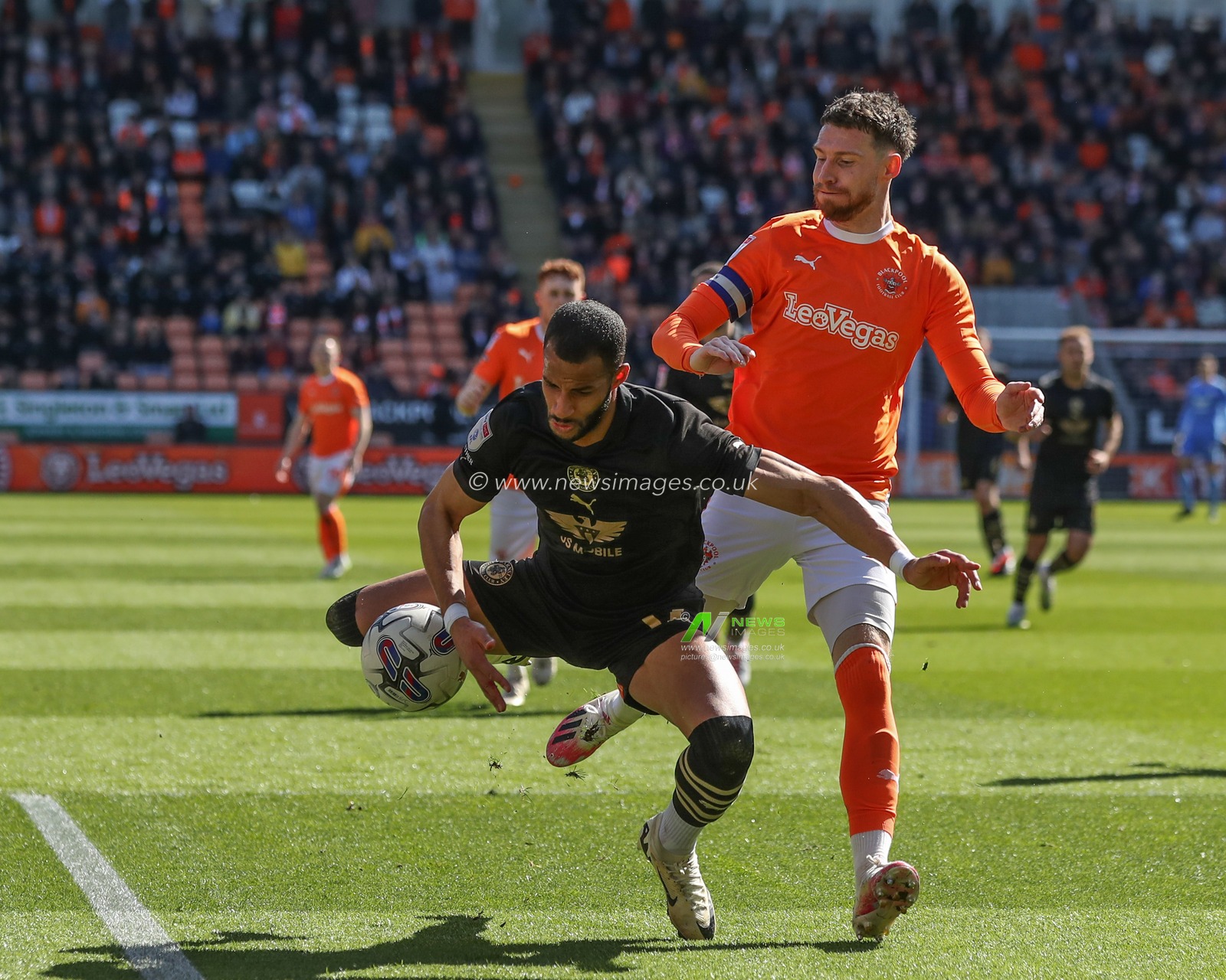 Barry Cotter of Barnsley falls as he breaks with the ball pressured by James Husband of Blackpool during the Sky Bet League 1 match Blackpool vs Barnsley at Bloomfield Road, Blackpool, United Kingdom, 20th April 2024

(Photo by Alfie Cosgrove/News Images)