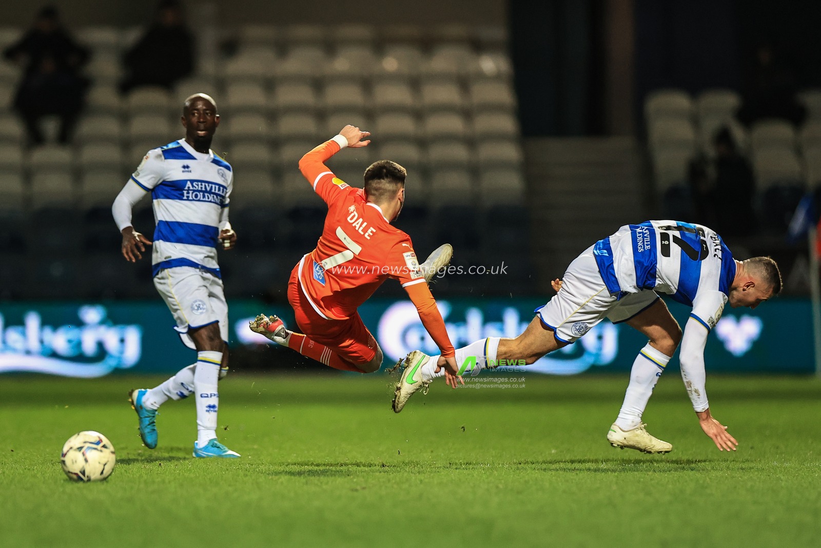 Owen Dale #7 of Blackpool is fouled by Dominic Ball #12 of Queens Park Rangers