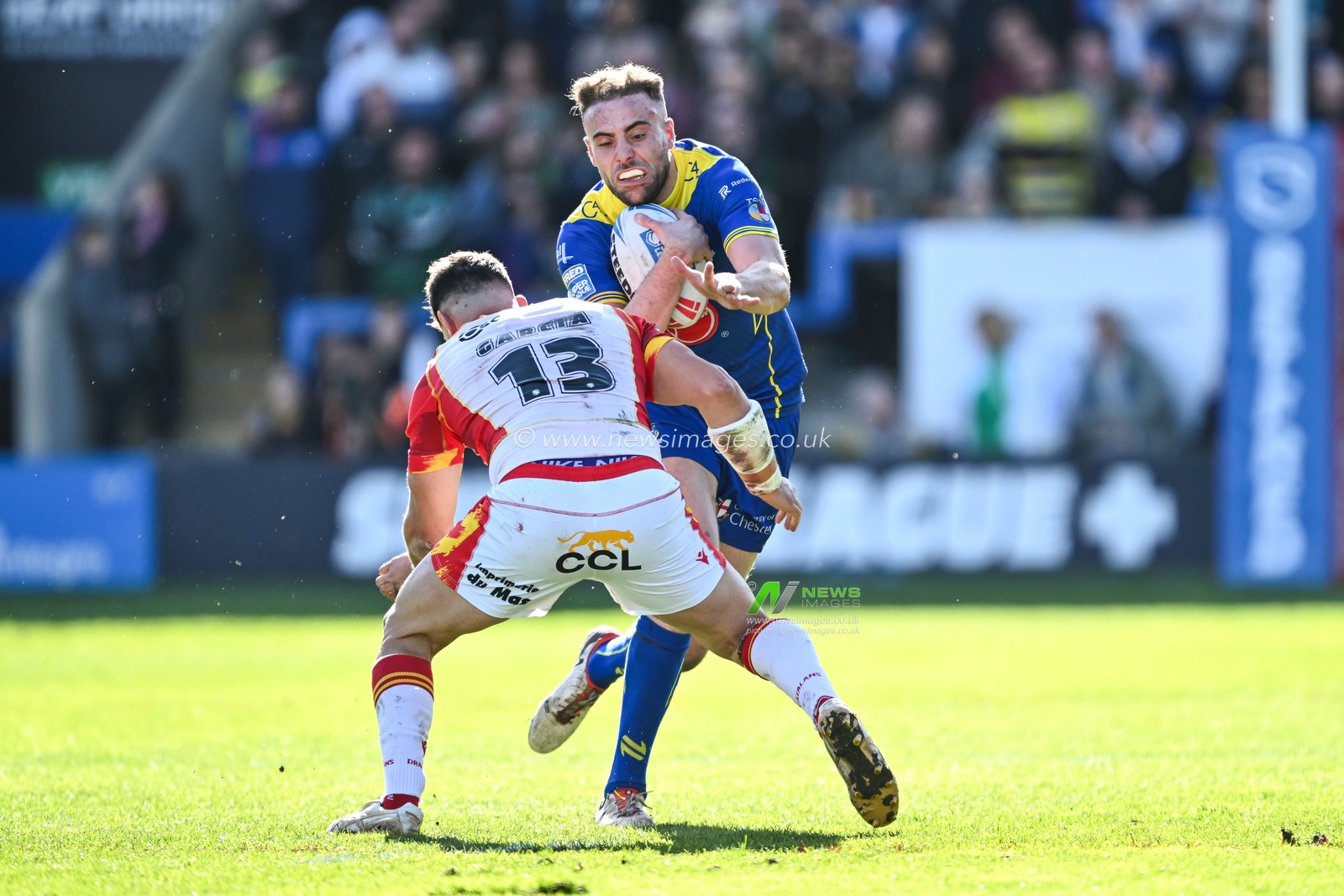 James Harrison of Warrington Wolves is tackled by Ben Garcia of Catalan Dragons during the Betfred Super League match Warrington Wolves vs Catalans Dragons at Halliwell Jones Stadium, Warrington, United Kingdom, 30th March 2024

(Photo by Craig Thomas/News Images)