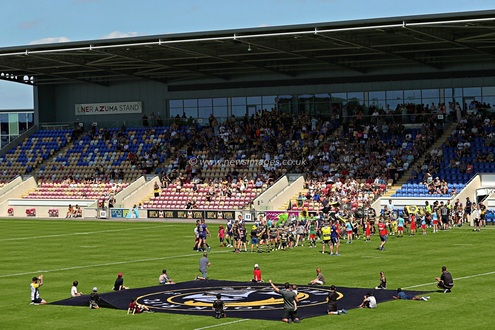 Both teams walk out before the Betfred Championship match York City Knights vs Featherstone Rovers at LNER Community Stadium, York, United Kingdom, 29th June 2025

(Photo by Sam Eaden/News Images)