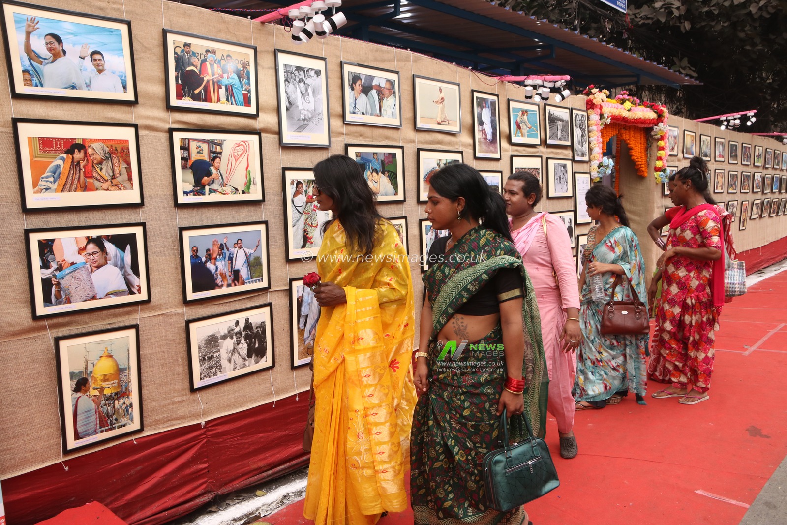 LGBTQ community watching  a photography exhibition organized by the cityÃ¢â‚¬â„¢s photojournalists, Around 120 photojournalists have come together to showcase their creativity, displaying 280 feature photos printed and exhibited on the streets under the open sky,The exhibition, now in its second year, The exhibition, titled 'Chitro Jetha Bhoy Shunyo', which means 'Where the Photos Are Without Fear'in Kolkata,India on February 2,2025.Pictures by Debajyoti Chakraborty.(Photo: Debajyoti Chakraborty/News Images)