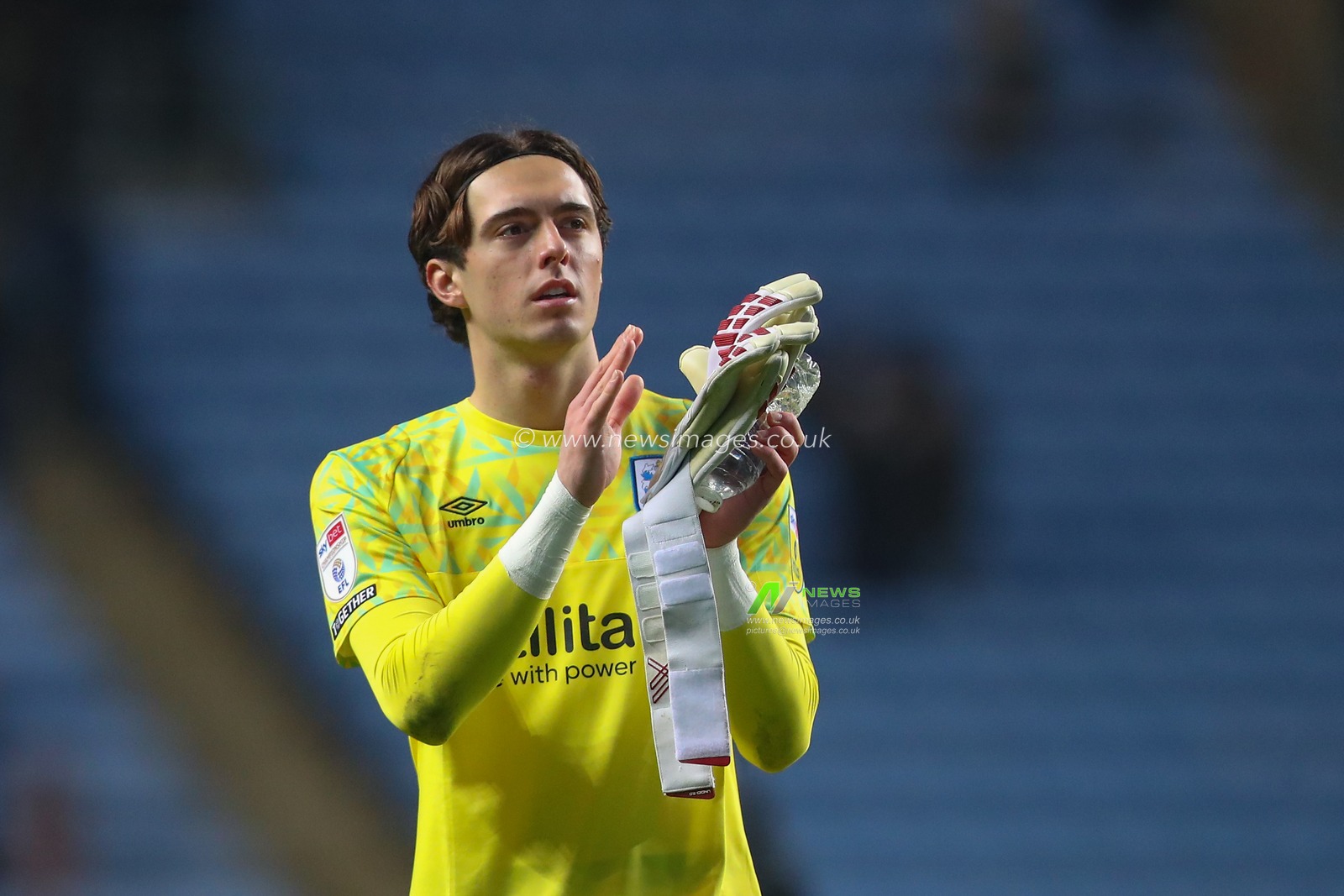 Nicholas Bilokapic #41 of Huddersfield Town applauds the travelling fans after the Sky Bet Championship match Coventry City vs Huddersfield Town at Coventry Building Society Arena, Coventry, United Kingdom, 28th January 2023

(Photo by Gareth Evans/News Images)