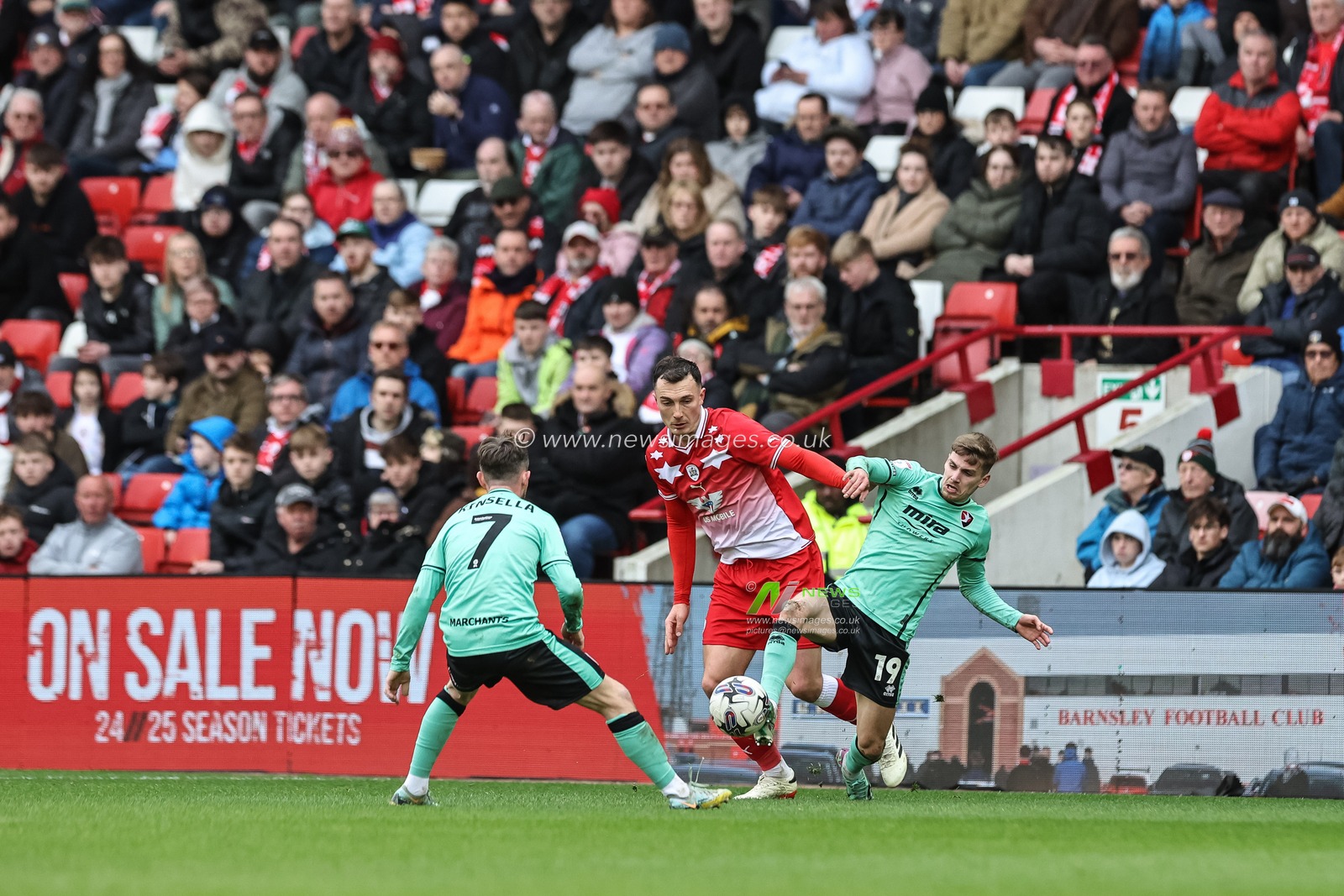 George Lloyd of Cheltenham Town and Josh Earl of Barnsley battle for the ball during the Sky Bet League 1 match Barnsley vs Cheltenham Town at Oakwell, Barnsley, United Kingdom, 16th March 2024

(Photo by Mark Cosgrove/News Images)