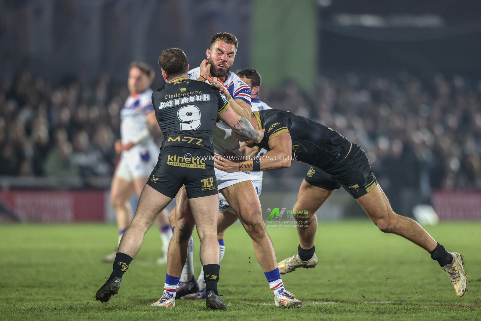 Mike McMeeken of Wakefield Trinity is tackled by Amir Bourouh of Hull FC and Jed Cartwright of Hull FC during the Betfred Super League Round 5 match Wakefield Trinity vs Hull FC at DIY Kitchens Stadium, Wakefield, United Kingdom, 21st March 2025

(Photo by Alfie Cosgrove/News Images)