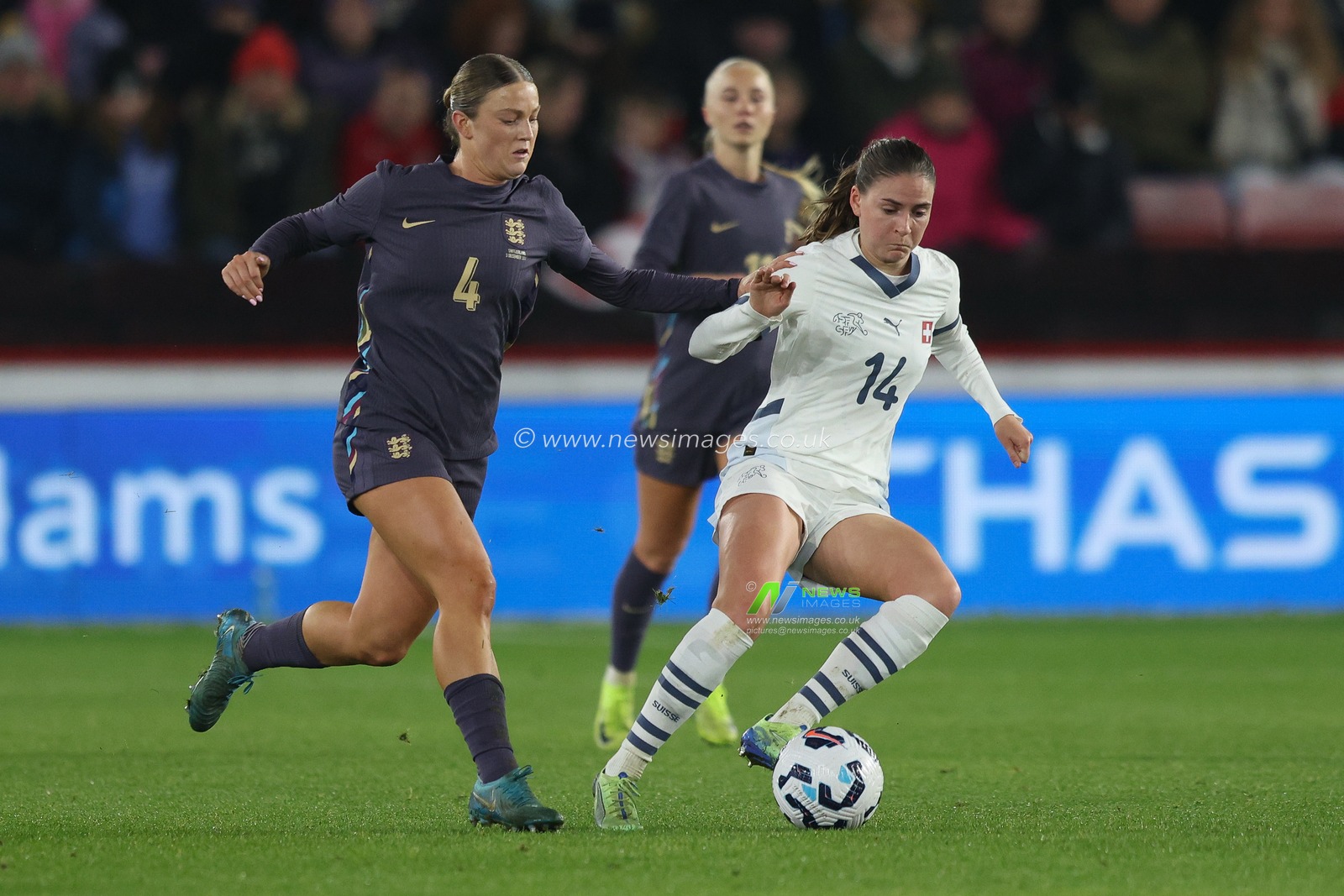 Smilla Vallotto of Switzerland is put under pressure by Grace Clinton of England during the Women's International Friendly match England Women vs Switzerland women at Bramall Lane, Sheffield, United Kingdom, 3rd December 2024

(Photo by Alex Roebuck/News Images)
