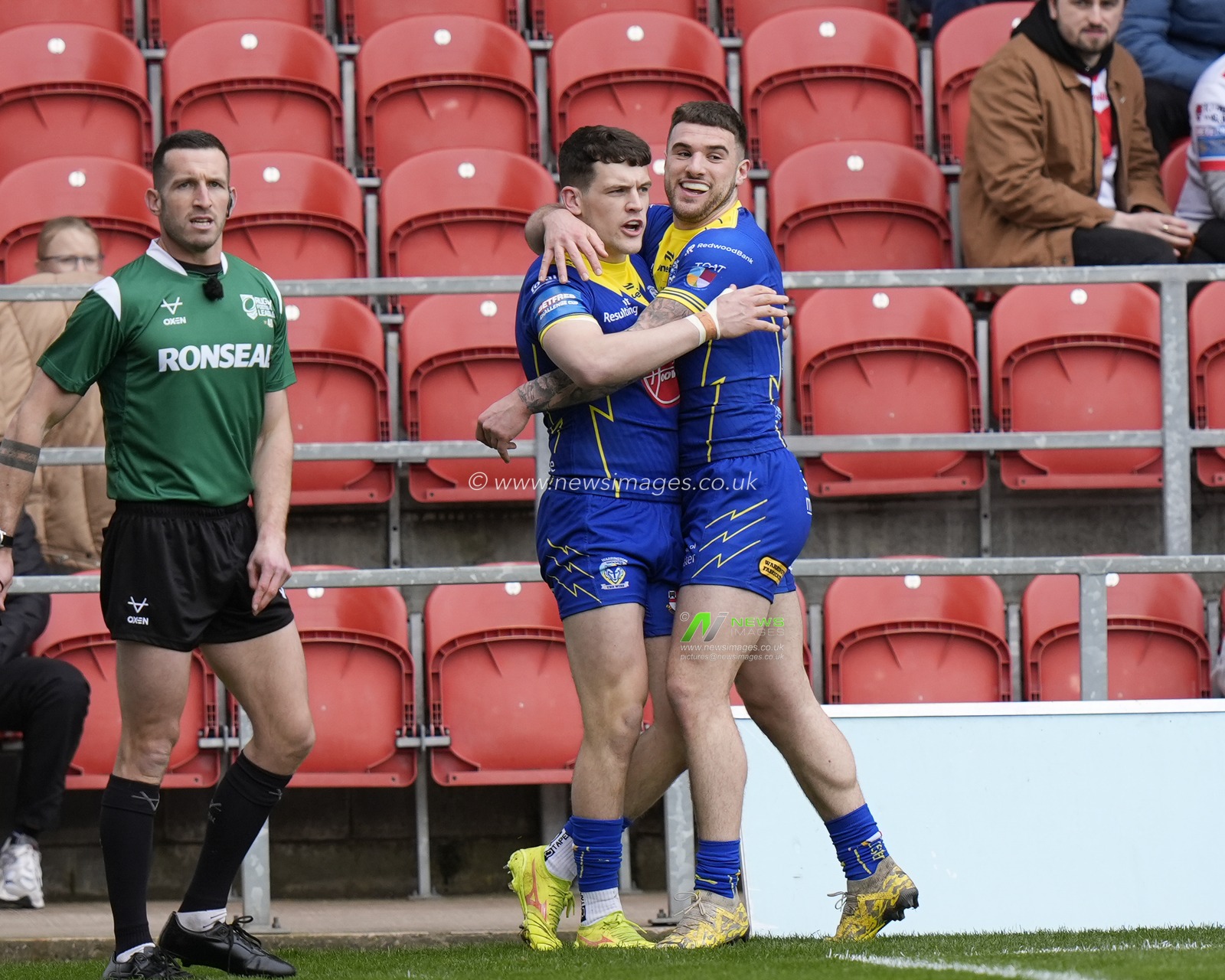Connor Wrench of Warrington Wolves celebrates with try scorer Josh Thewlis of Warrington Wolves during the Betfred Challenge Cup Quarter Final match St Helens vs Warrington Wolves at Totally Wicked Stadium, St Helens, United Kingdom, 14th April 2024

(Photo by Steve Flynn/News Images)