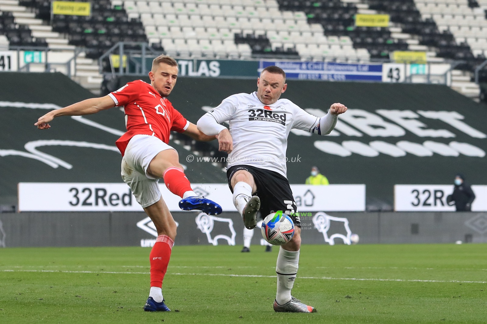 Michal Helik #30 of Barnsley blocks Wayne Rooney #32 of Derby Countyâ€™s shot on goal