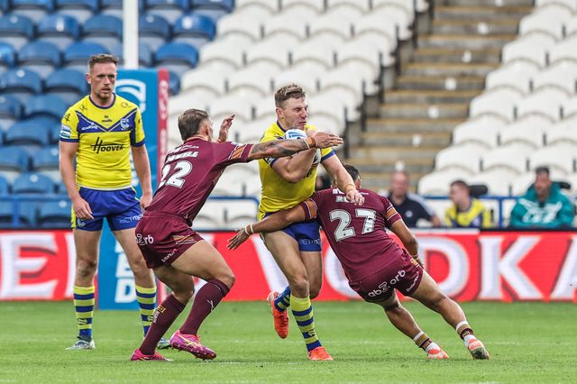 George Williams of Warrington Wolves is tackled during the Betfred Super League Round 23 match Huddersfield Giants vs Warrington Wolves at Accu Stadium, Huddersfield, United Kingdom, 24th August 2025

(Photo by Alfie Cosgrove/News Images)