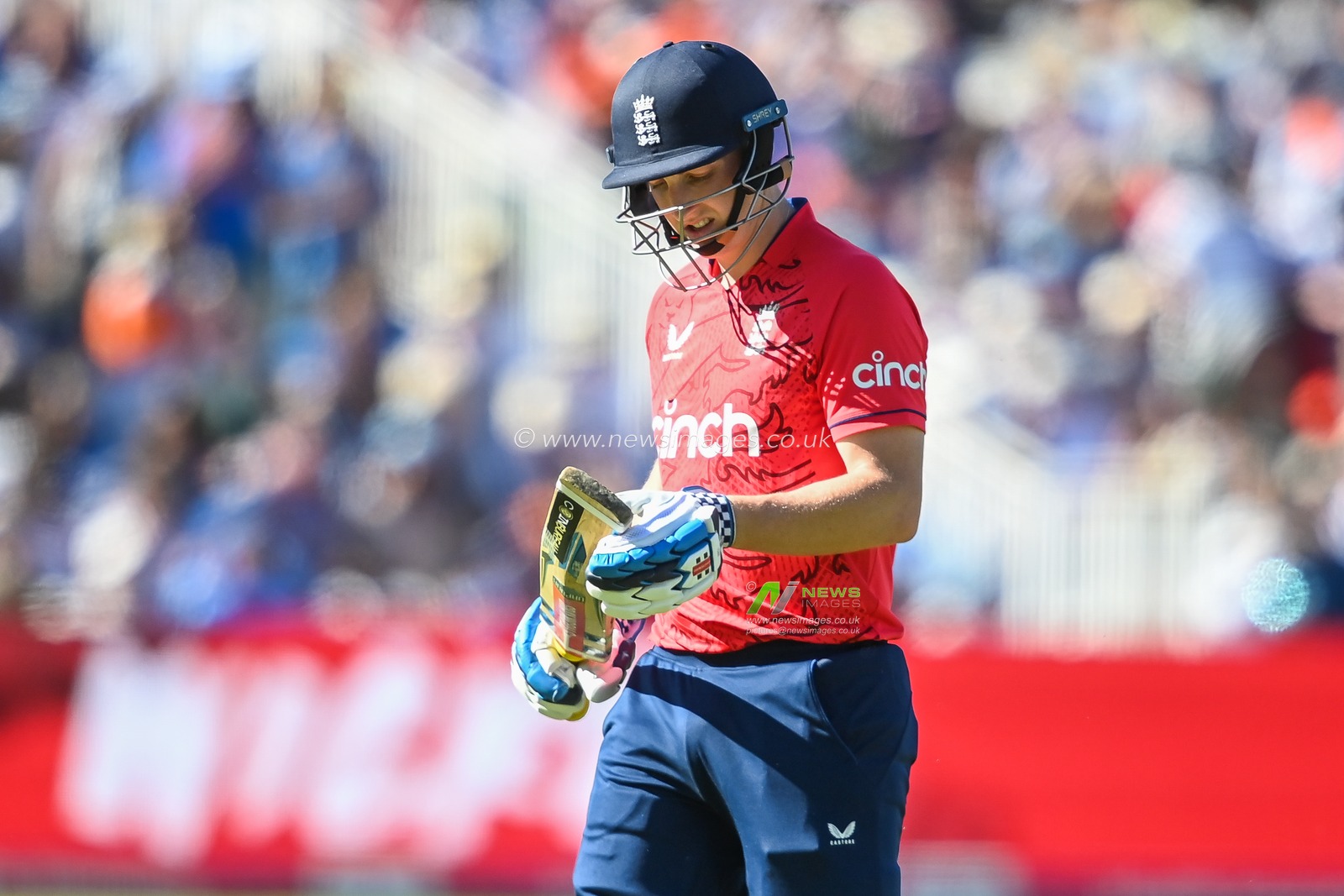 Harry Brook of England leaves the field after being caught out by Suryakumar Yadav off the bowling of Yuzvendra Chahal
