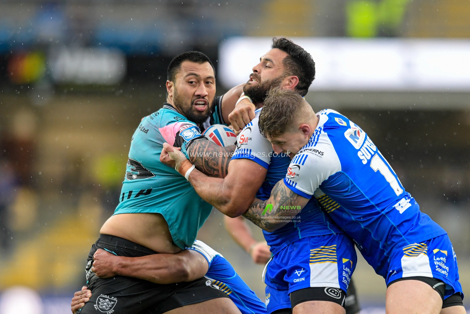 Ligi Sao (13) of Hull FC attempts to break through the Leeds Rhinos defence