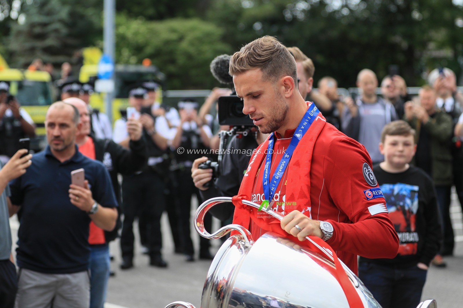 2nd June 2019 , Liverpool, England; UEFA Champions League, Liverpool FC Champions League winners celebrations and open top bus parade ; Jordan Henderson (14) of Liverpool with the European cup


Credit: Mark Cosgrove/News Images