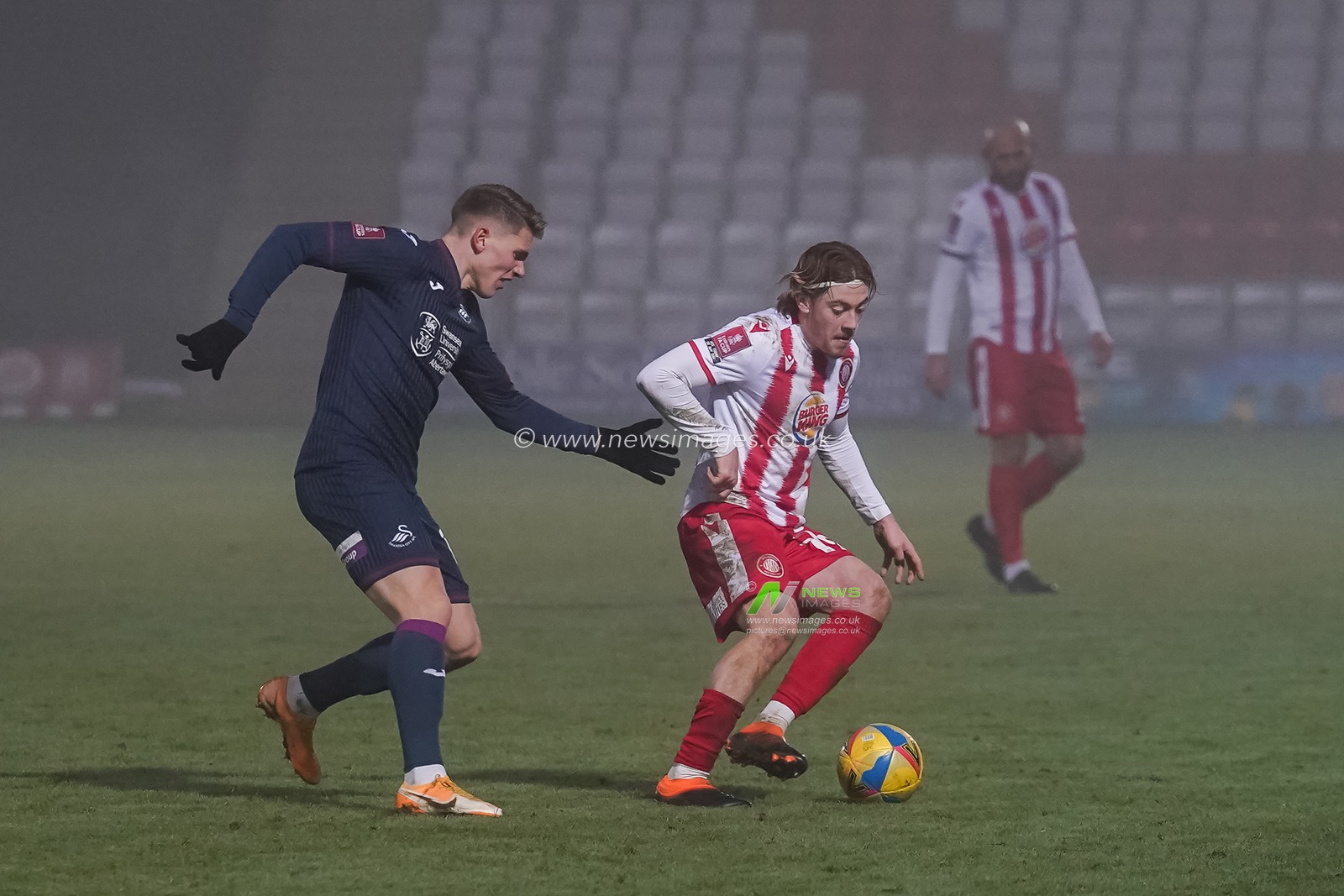 Viktor Gyokeres #14 of Swansea City battles with Arthur Read #19 of Stevenage