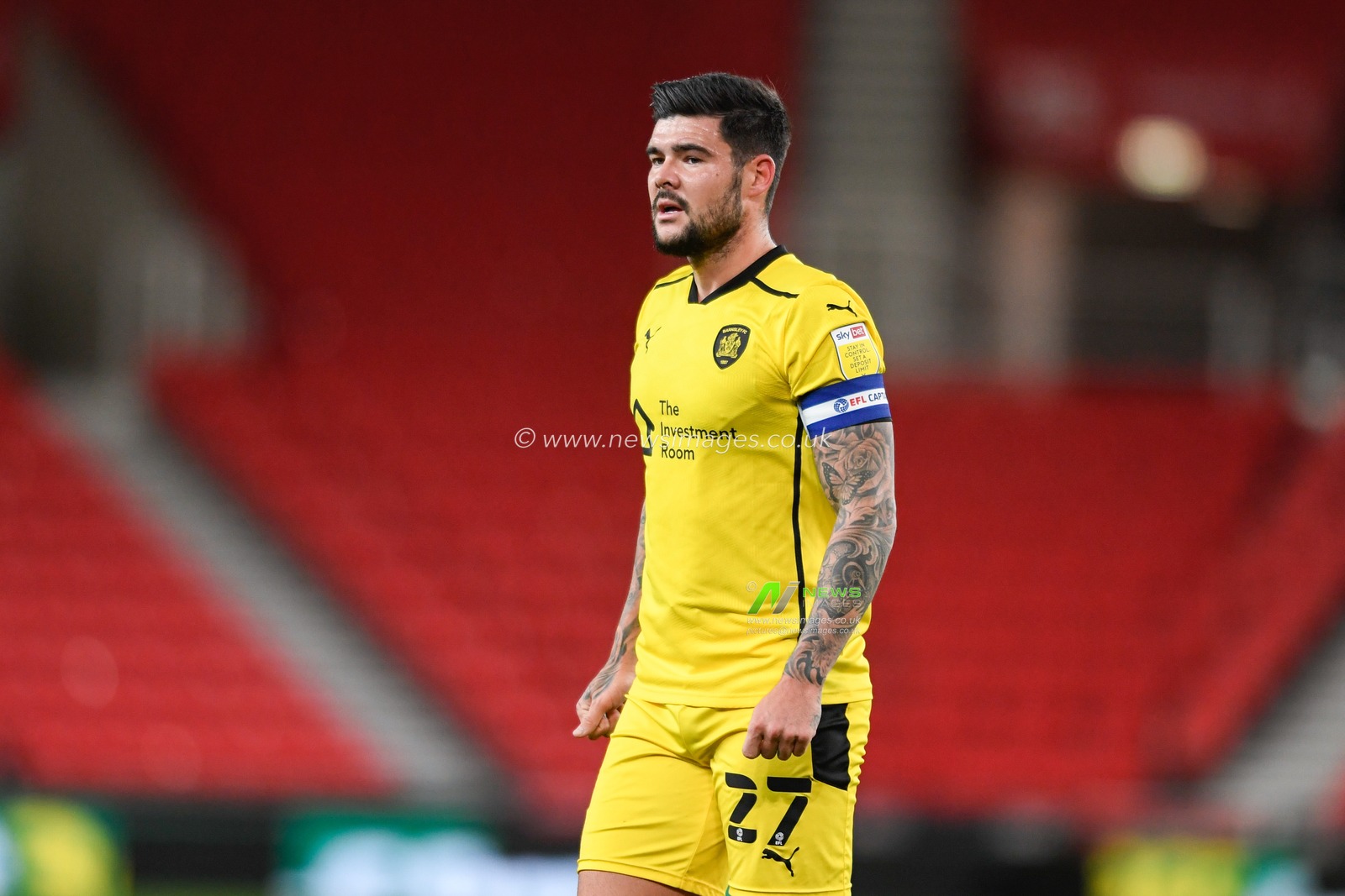 Alex Mowatt (27) of Barnsley in action during the game