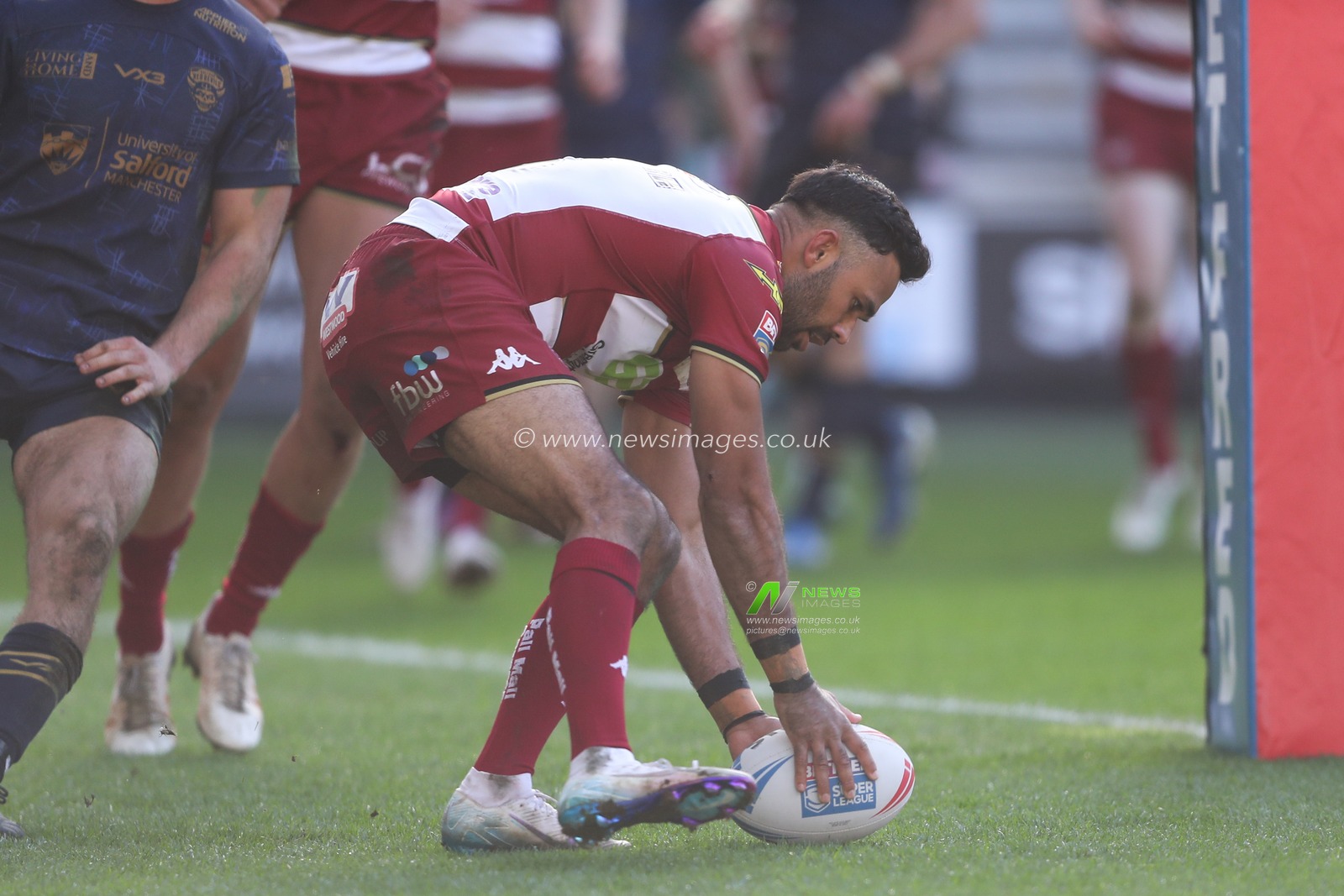 Bevan French of Wigan Warriors goes over for a try and makes the score 30-0 during the Betfred Super League Round 6 match Wigan Warriors vs Salford Red Devils at The Brick Community Stadium, Wigan, United Kingdom, 30th March 2025

(Photo by Gareth Evans/News Images)