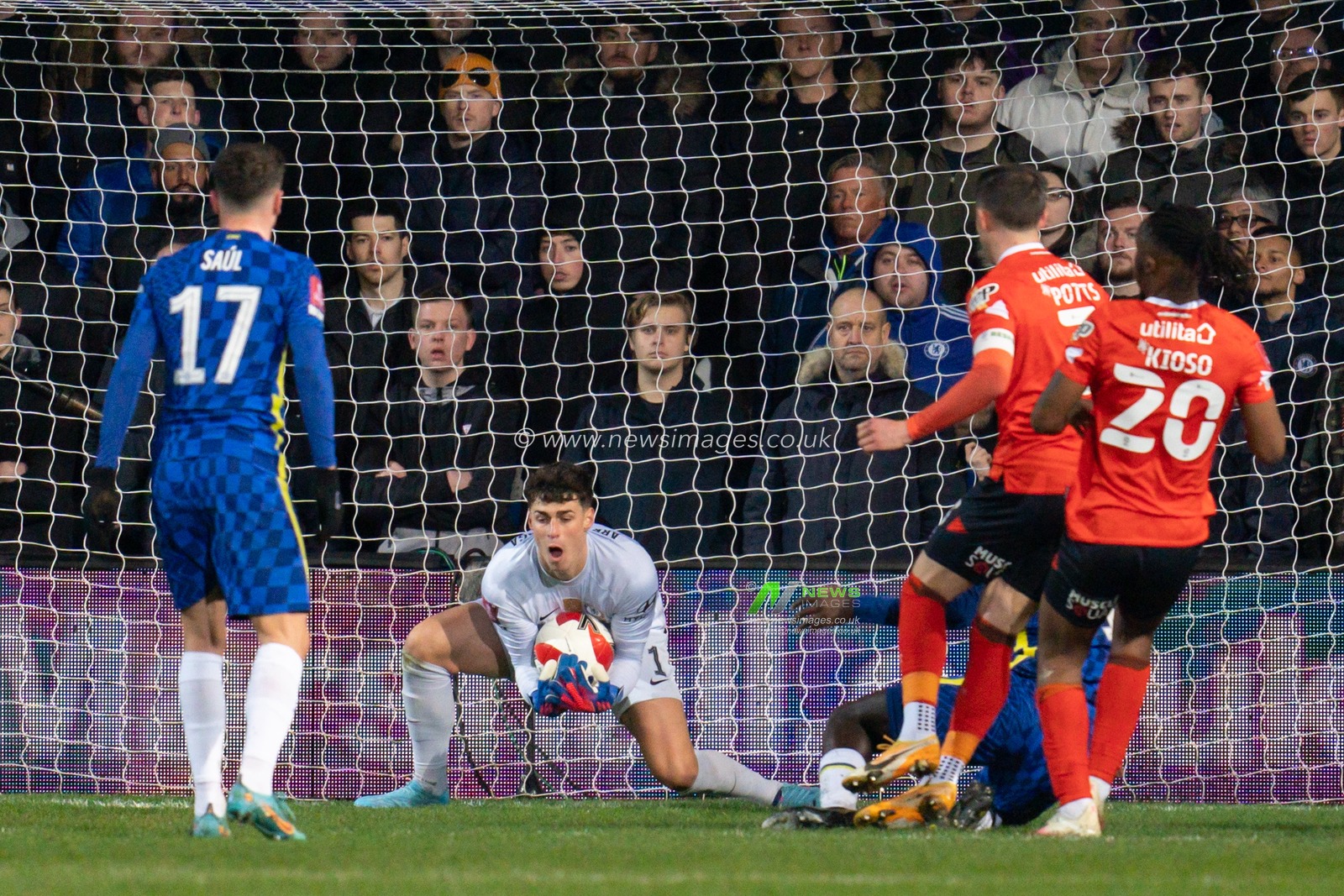 Kepa Arrizabalaga #1 of Chelsea saves the header from Dan Potts #3 of Luton Town