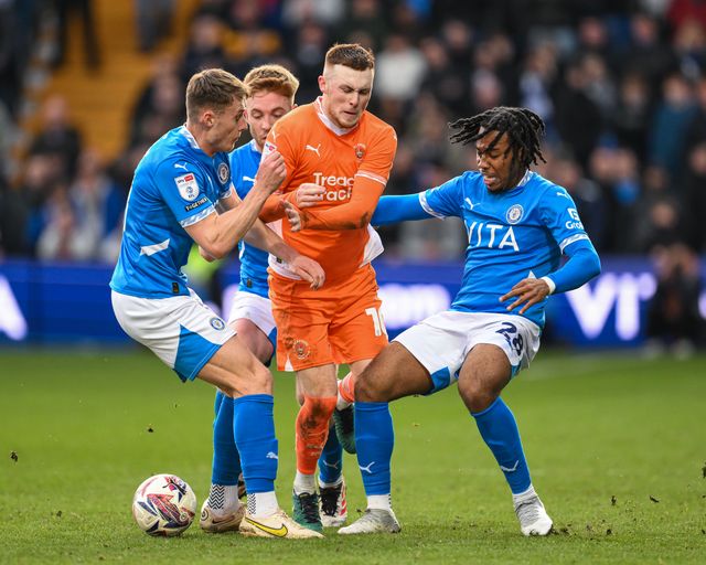 Sonny Carey of Blackpool is tackled by Micah Hamilton of Stockport County during the Sky Bet League 1 match Stockport County vs Blackpool at Edgeley Park Stadium, Stockport, United Kingdom, 1st March 2025

(Photo by Craig Thomas/News Images)