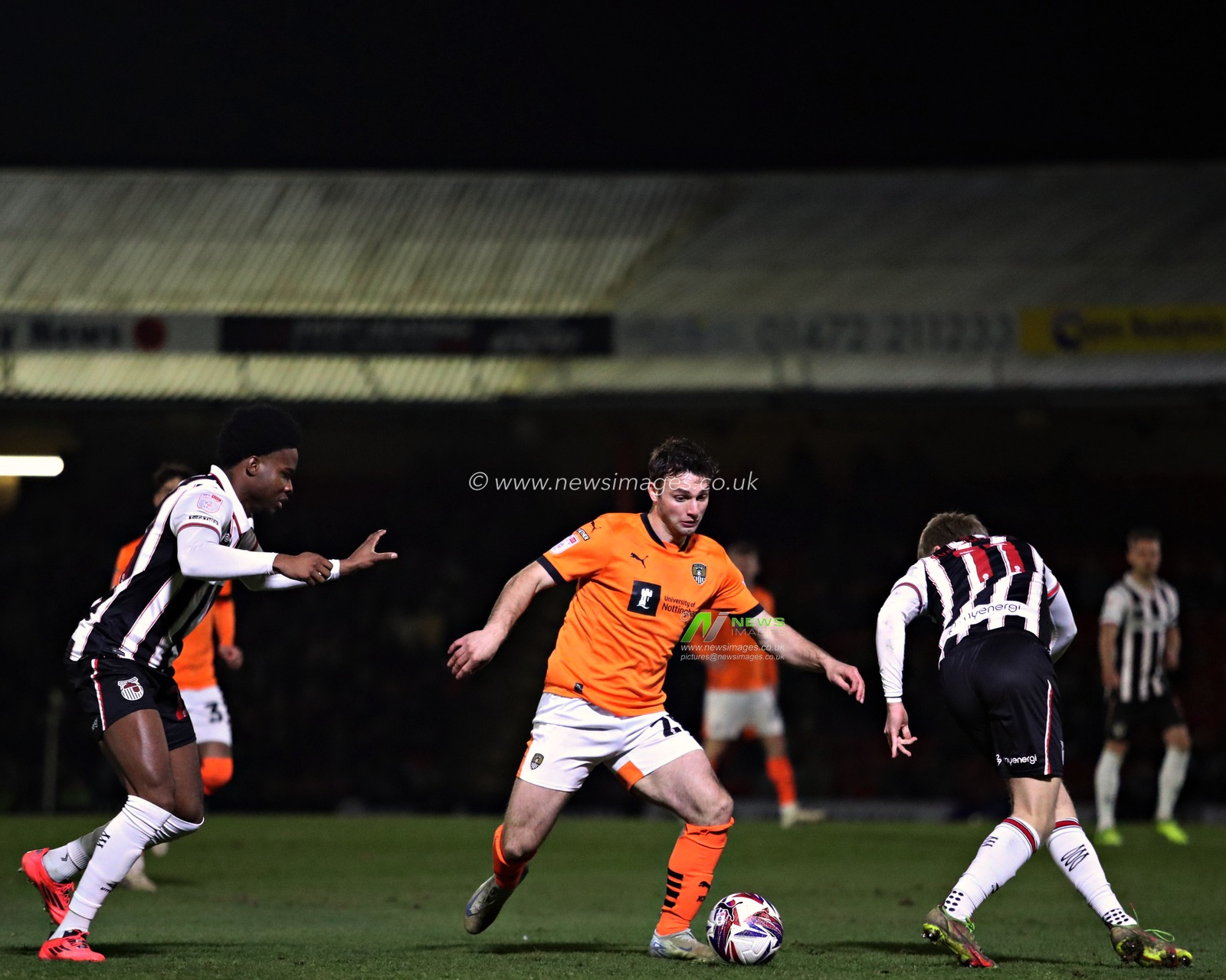 Nicholas Tsaroulla of Notts County is pressured by Tyrell Warren of Grimsby Town and Jason DaÃ°i SvanÃ¾Ã³rsson of Grimsby Town during the Sky Bet League 2 match Grimsby Town vs Notts County at Blundell Park, Cleethorpes, United Kingdom, 11th March 2025

(Photo by Sam Eaden/News Images)