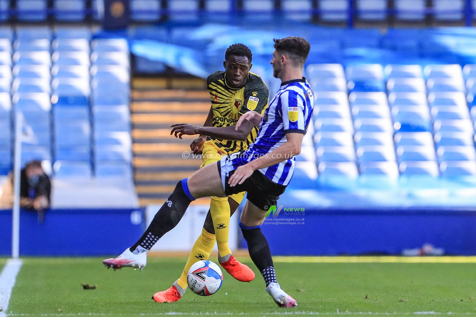Jeremy Ngakia (3) of Watford  is challenged by Matt Penney (14) of Sheffield Wednesday