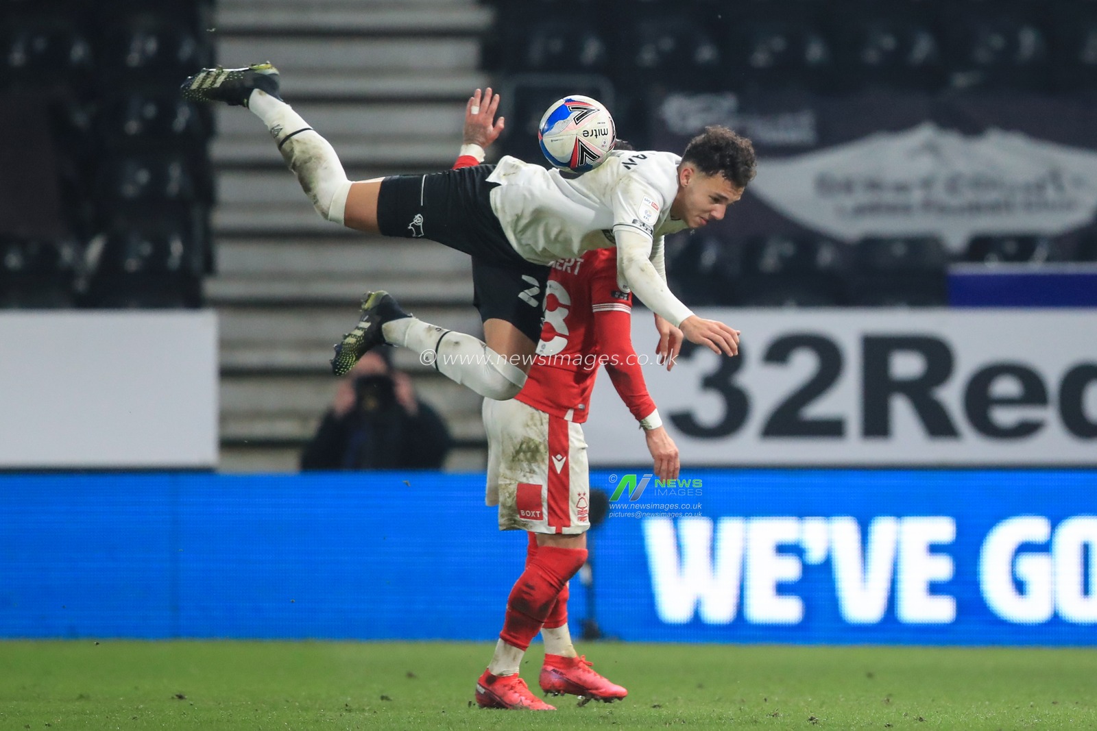 Lee Buchanan #26 of Derby County and Anthony Knockaert #28 of Nottingham Forest dual for the ball